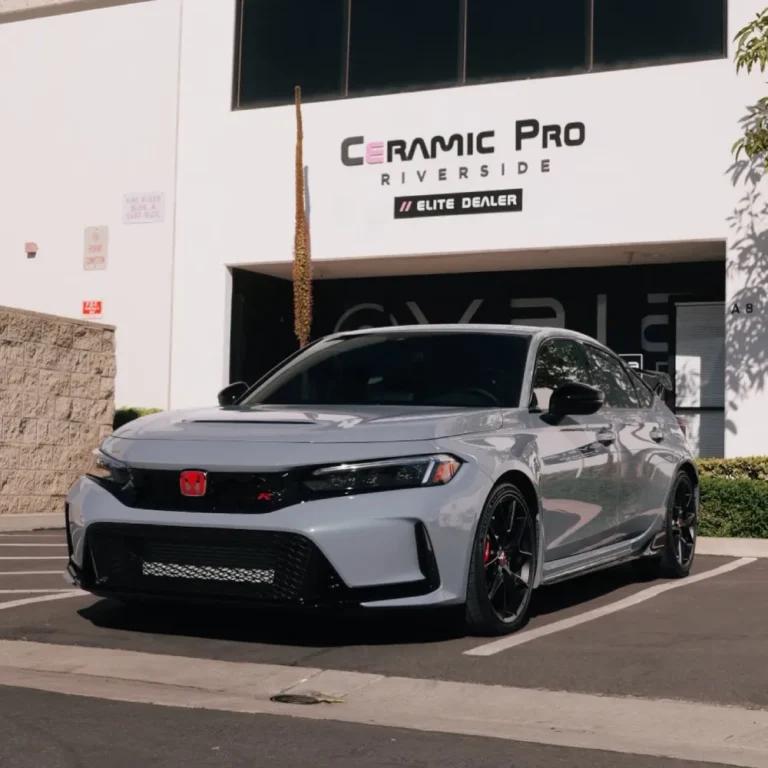 Grey Honda Civic Type R parked outside a shop ready for paint protection film application.